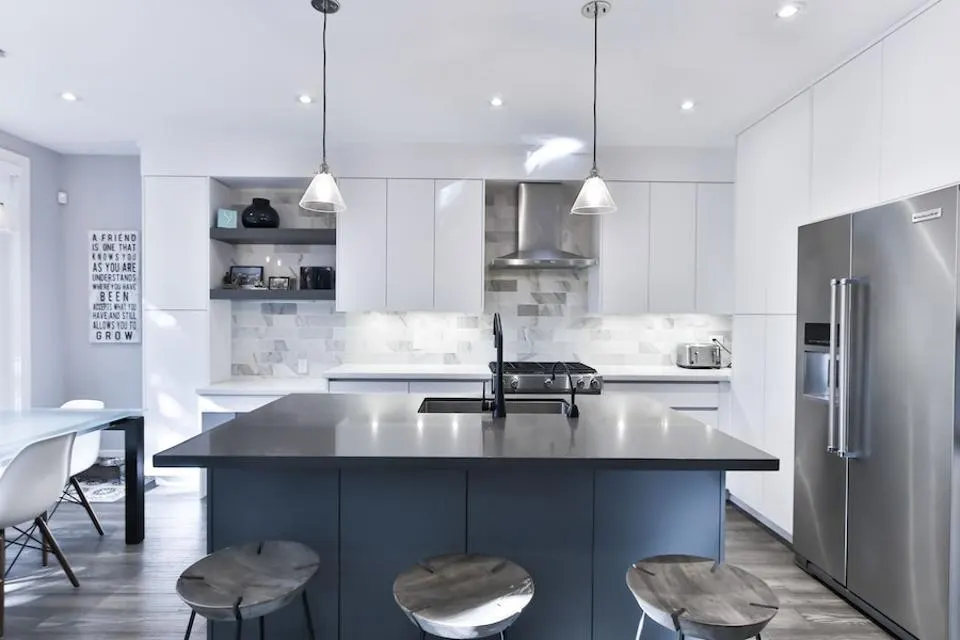 Modern kitchen design inspiration with bright cabinetry and a dark island